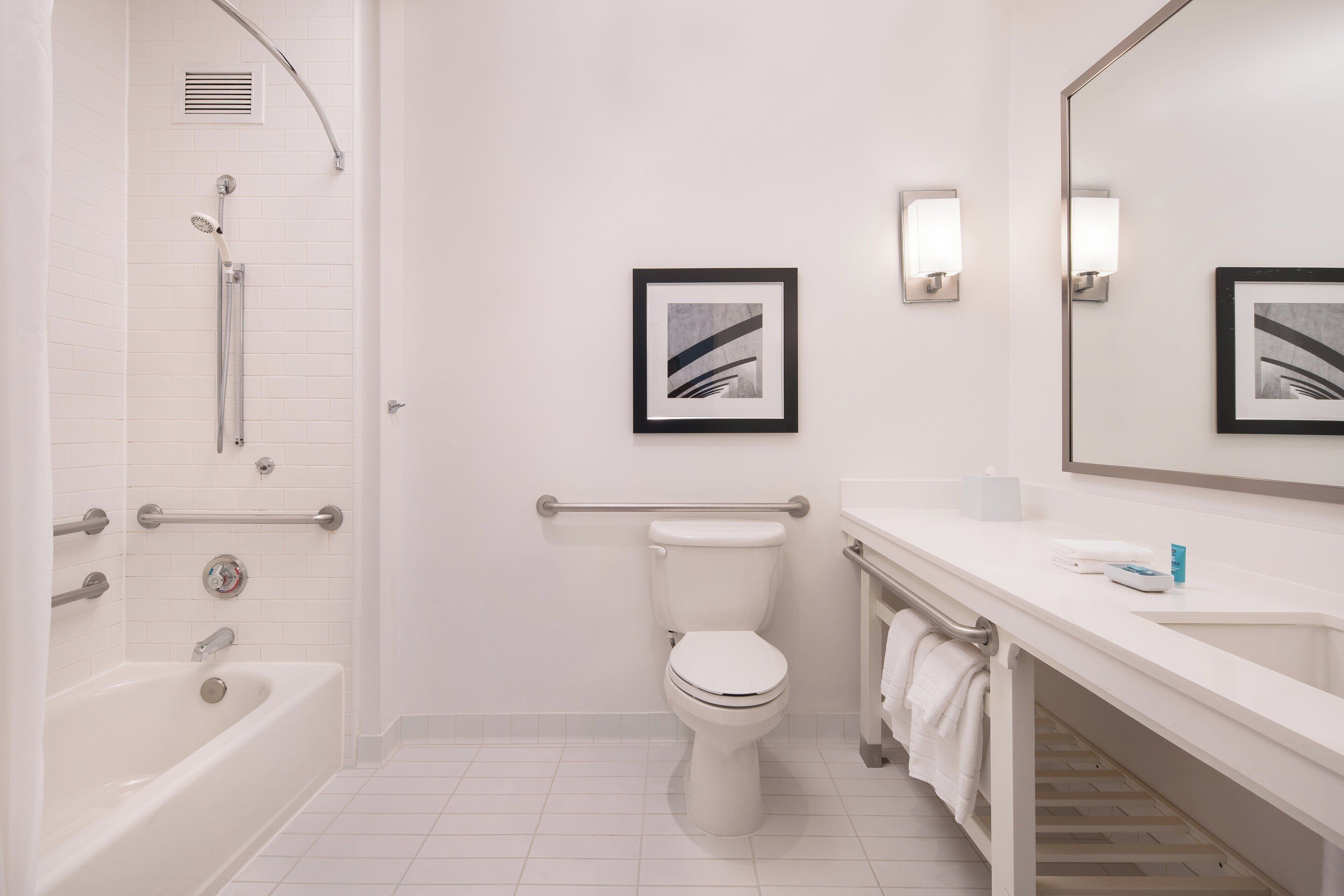 room, 1 king bed | bathroom | rainfall showerhead, designer toiletries, hair dryer, towels