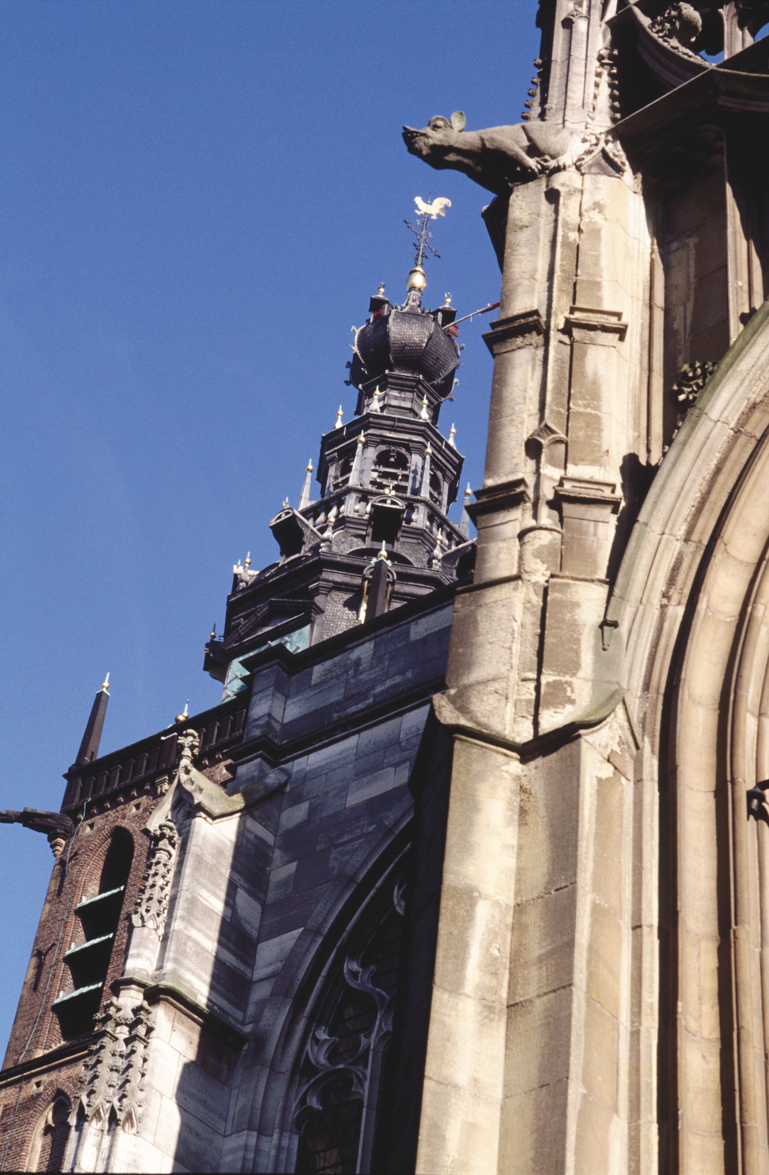 A historic building with intricate stonework and a prominent clock tower.