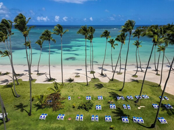 On the beach, sun loungers, beach towels, beach bar