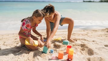 On the beach, sun loungers, beach towels