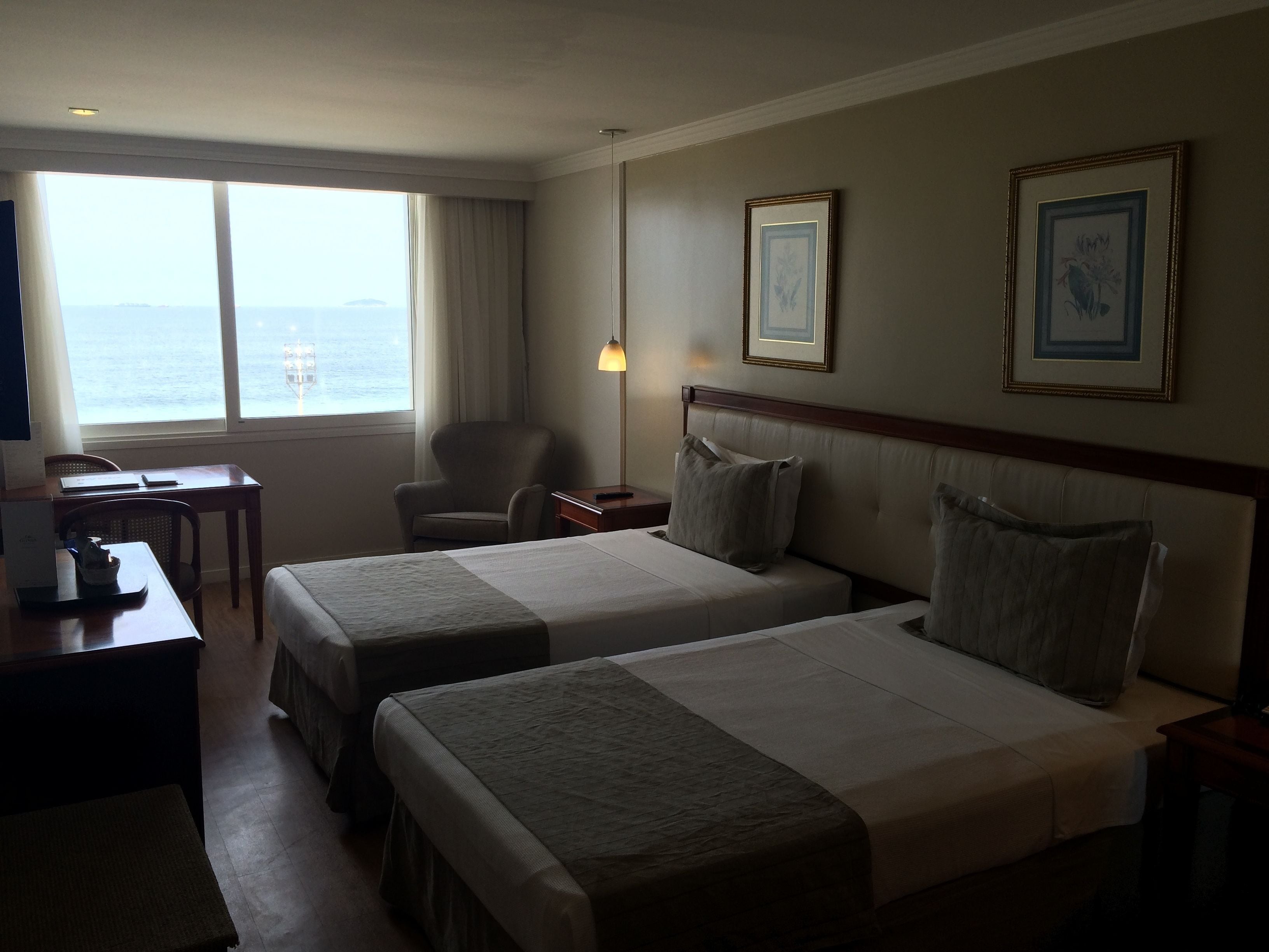 deluxe room, sea view | minibar, in-room safe, desk, laptop workspace