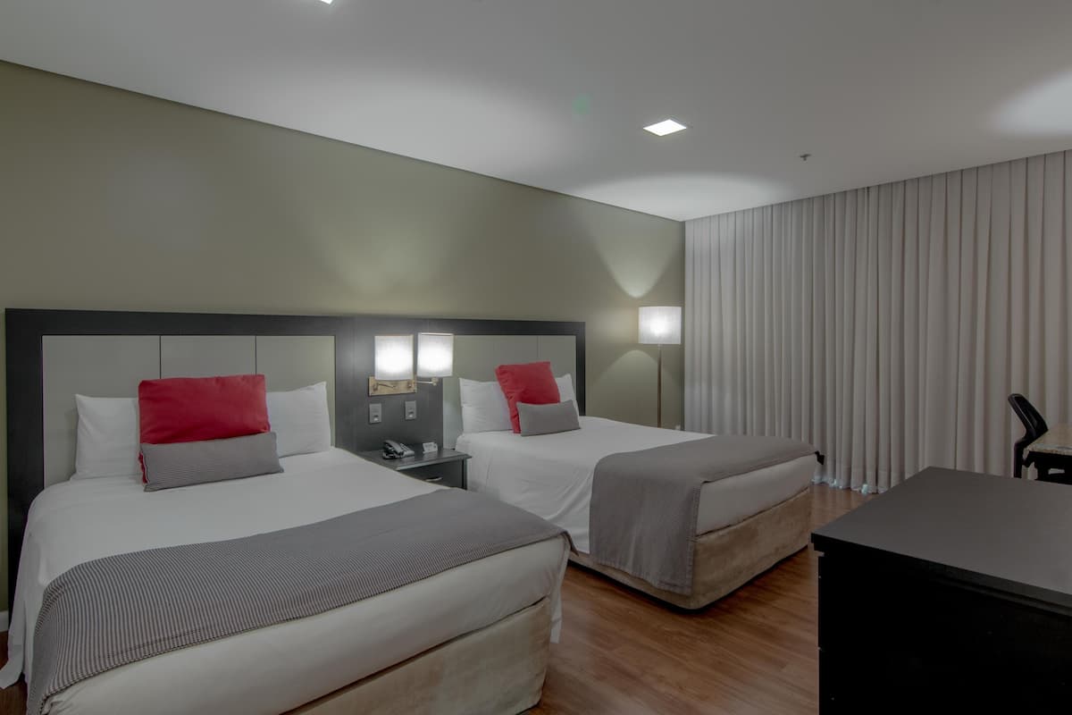 deluxe twin room | minibar, in-room safe, desk, blackout curtains