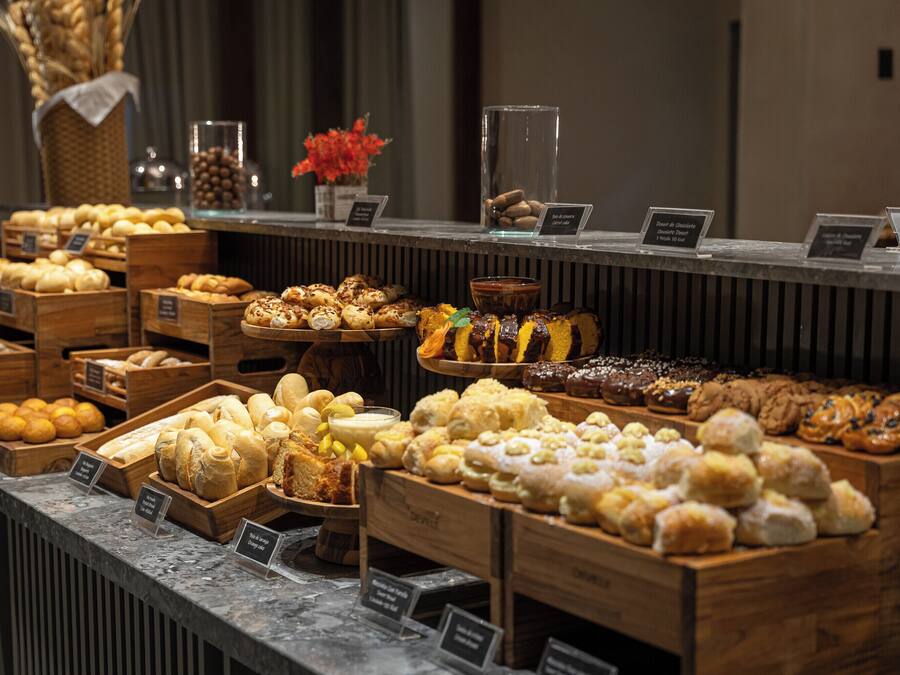 A bakery display with various baked goods.