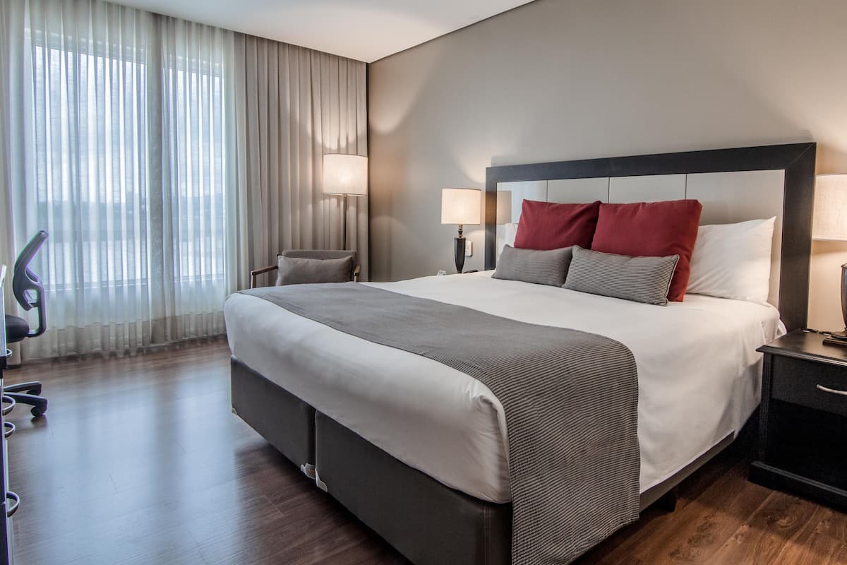 Deluxe Double Room | Minibar, in-room safe, desk, blackout curtains