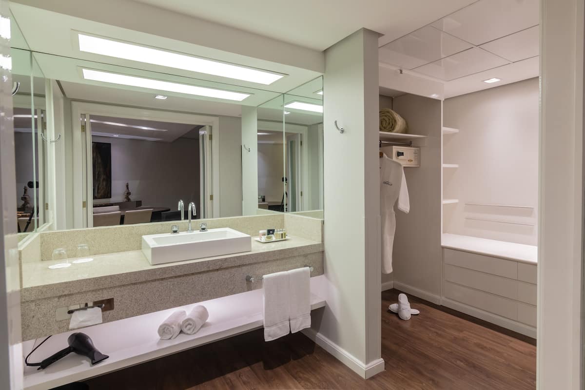 suite | bathroom | shower, hair dryer, towels