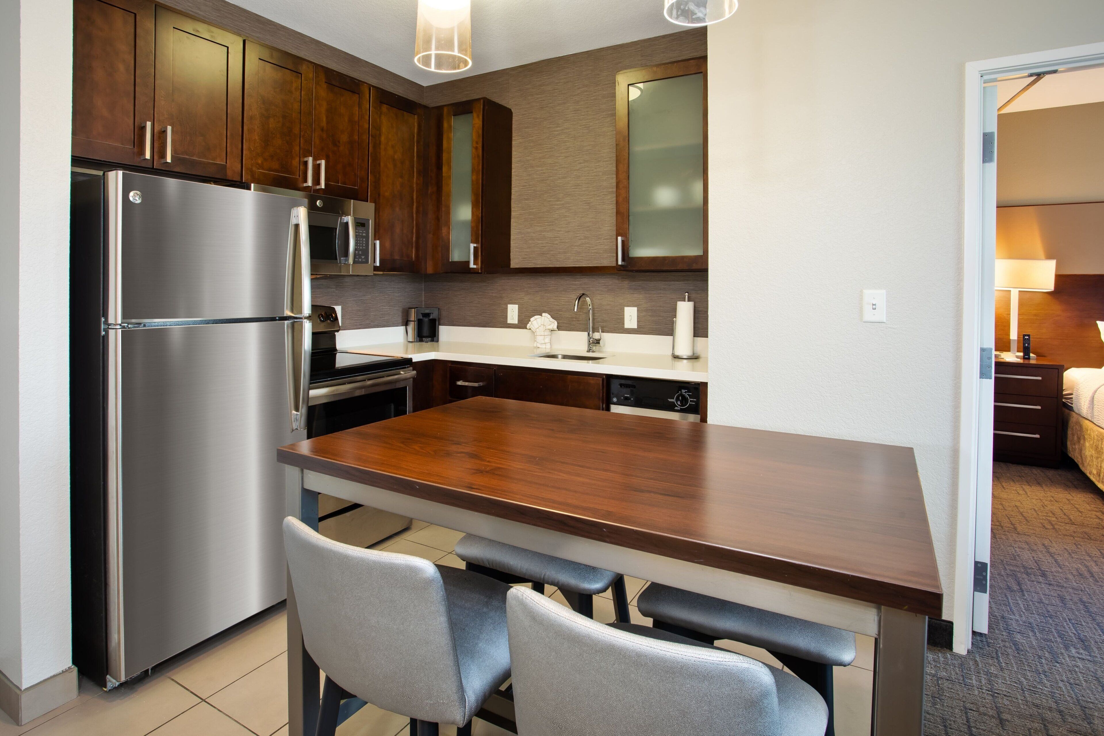 full-sized fridge, microwave, stovetop, dishwasher