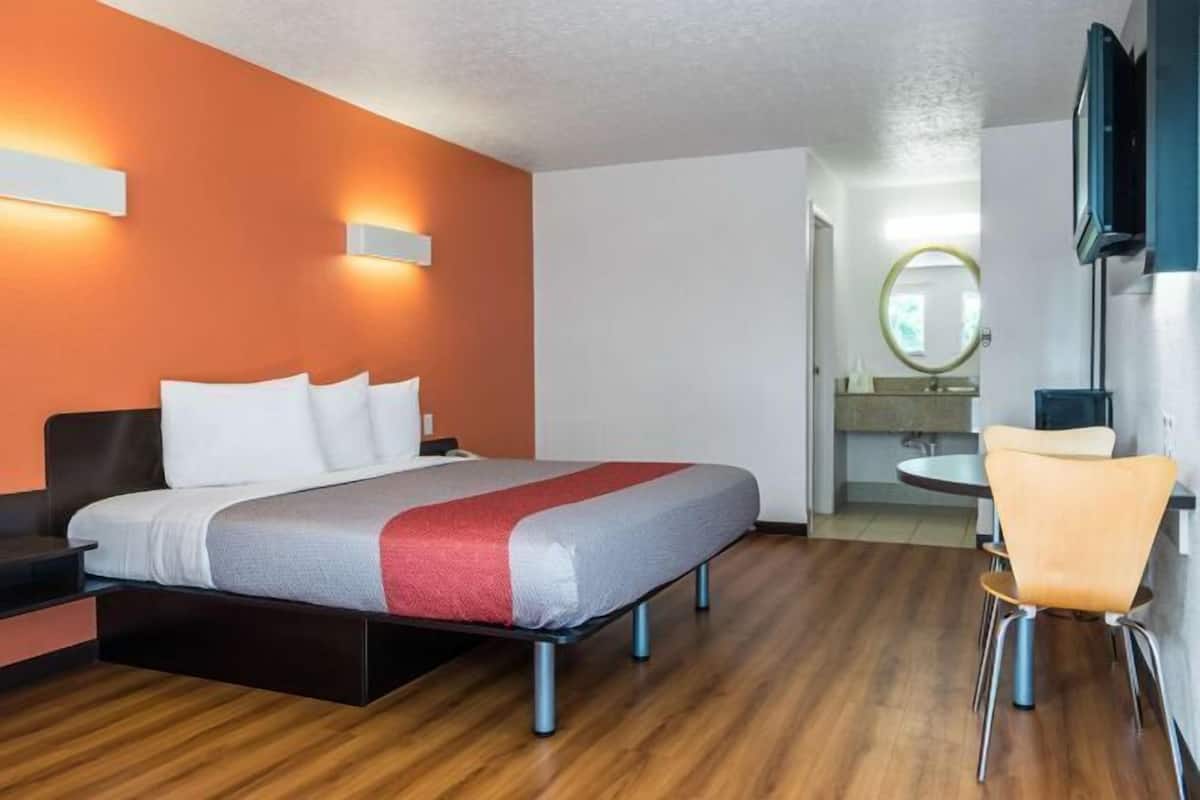Hypo-allergenic bedding, desk, laptop workspace, blackout curtains