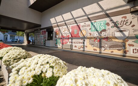 A mural with coffee-related illustrations and text, including "Latte," "Mocha," and "Buckeye."