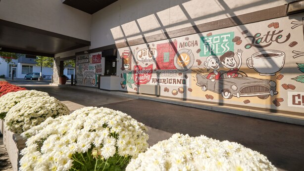 A mural with coffee-related illustrations and text, including "Latte," "Mocha," and "Buckeye." - Olentangy Motor Inn (Columbus)