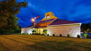 A hotel with a stone facade, a red roof, and a sign reading "Best Western." - Best Western Clermont (Cincinnati)