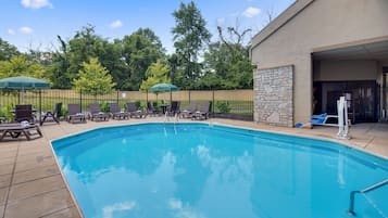 Seasonal outdoor pool, pool loungers