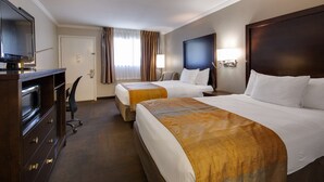A hotel room with two beds, a desk, a TV, and a minibar. - Best Western Clermont (Cincinnati)