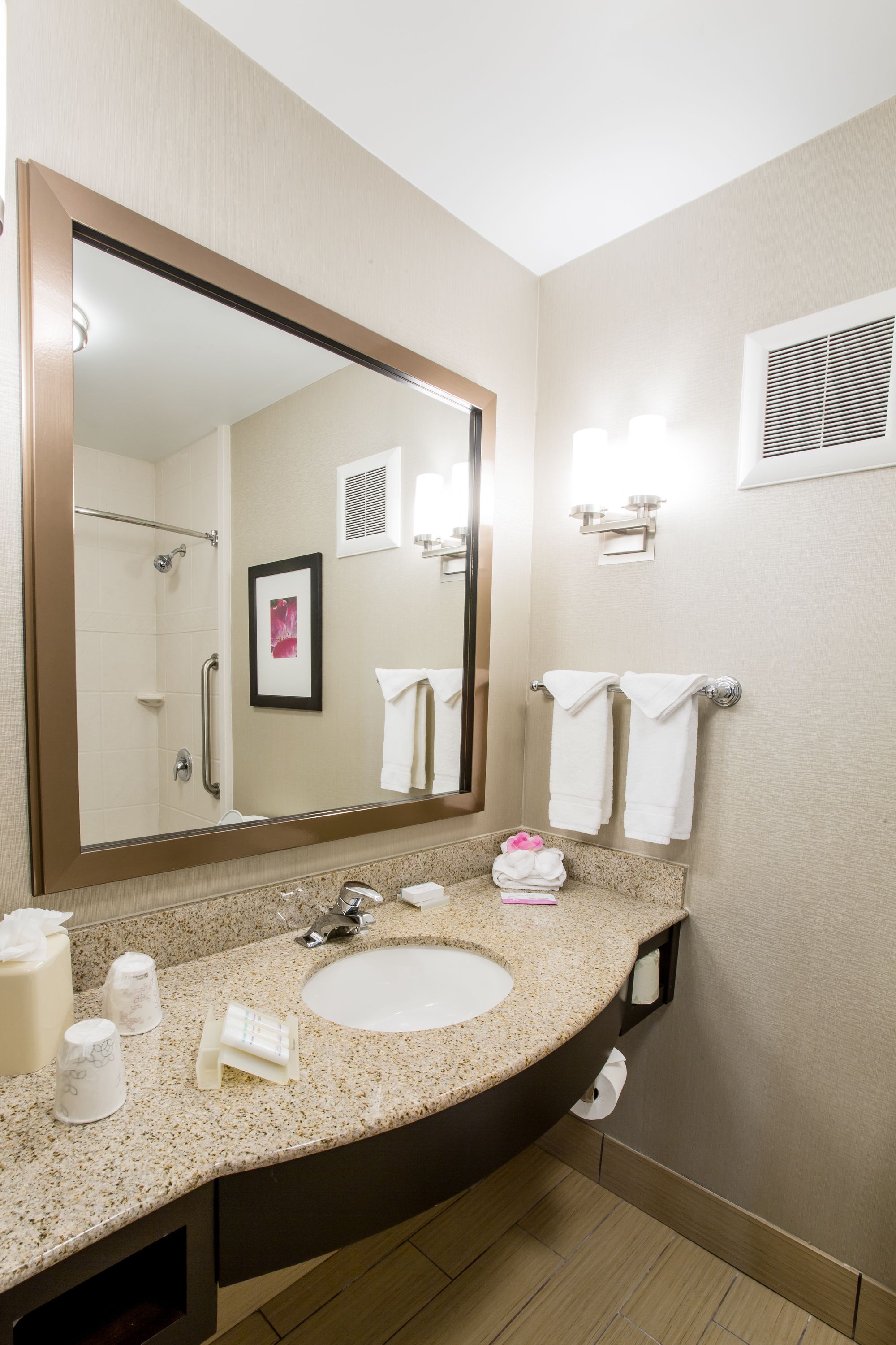 hydromassage showerhead, designer toiletries, hair dryer, towels