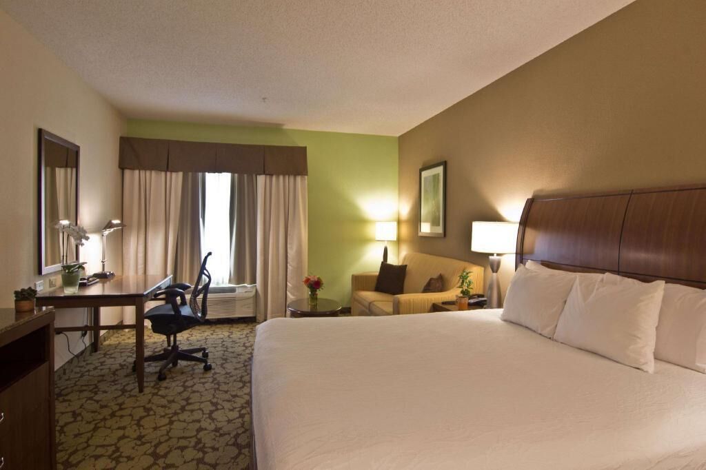 Desk, laptop workspace, blackout drapes, iron/ironing board