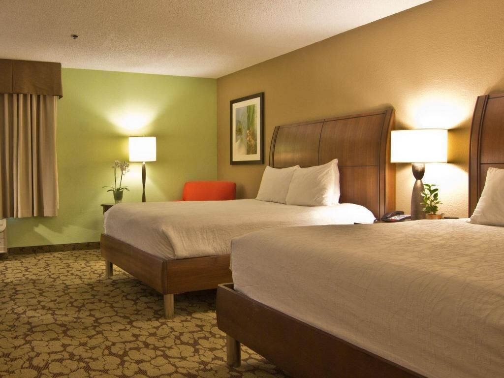 Desk, laptop workspace, blackout drapes, iron/ironing board