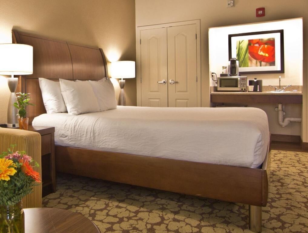 Desk, laptop workspace, blackout drapes, iron/ironing board