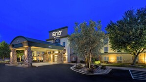 A hotel with a covered entrance, stone pillars, and a sign reading "Garnier An IHG Hotel".