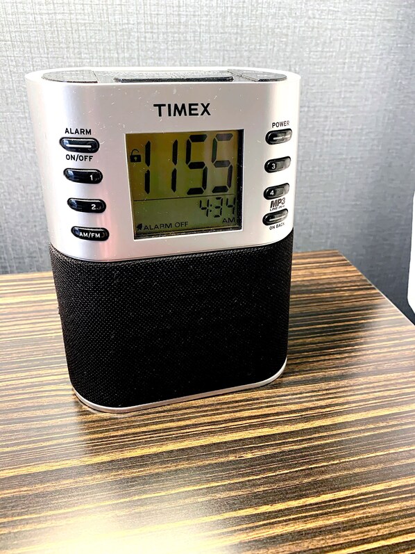 A TIMEX alarm clock with a digital display, alarm buttons, and a power switch. - Holiday Inn St. Paul Downtown by IHG (St. Paul)