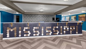 A reception desk with a geometric pattern and the word 'MISSISSIPPI' on it.