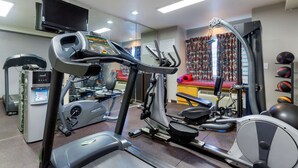 A gym with treadmills, elliptical machines, and exercise balls. - Quality Inn Sallisaw (Sallisaw)