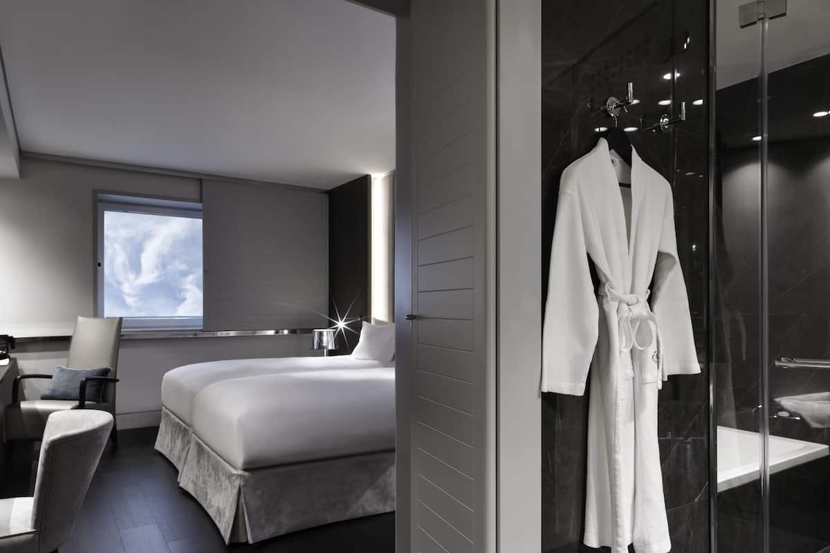 Premium bedding, memory-foam beds, in-room safe, desk