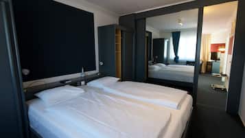 Deluxe Quadruple Room, 1 Bedroom, Balcony | Hypo-allergenic bedding, minibar, desk, blackout drapes