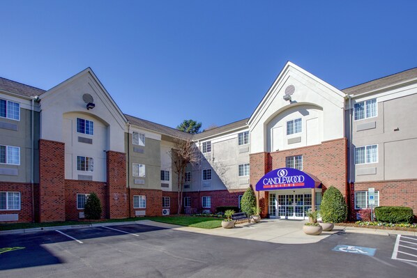 Welcome to Candlewood Suites, a hotel with a convenient entrance and ample parking.
