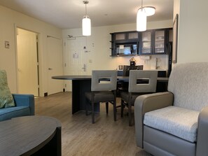 Desk, laptop workspace, blackout curtains, iron/ironing board