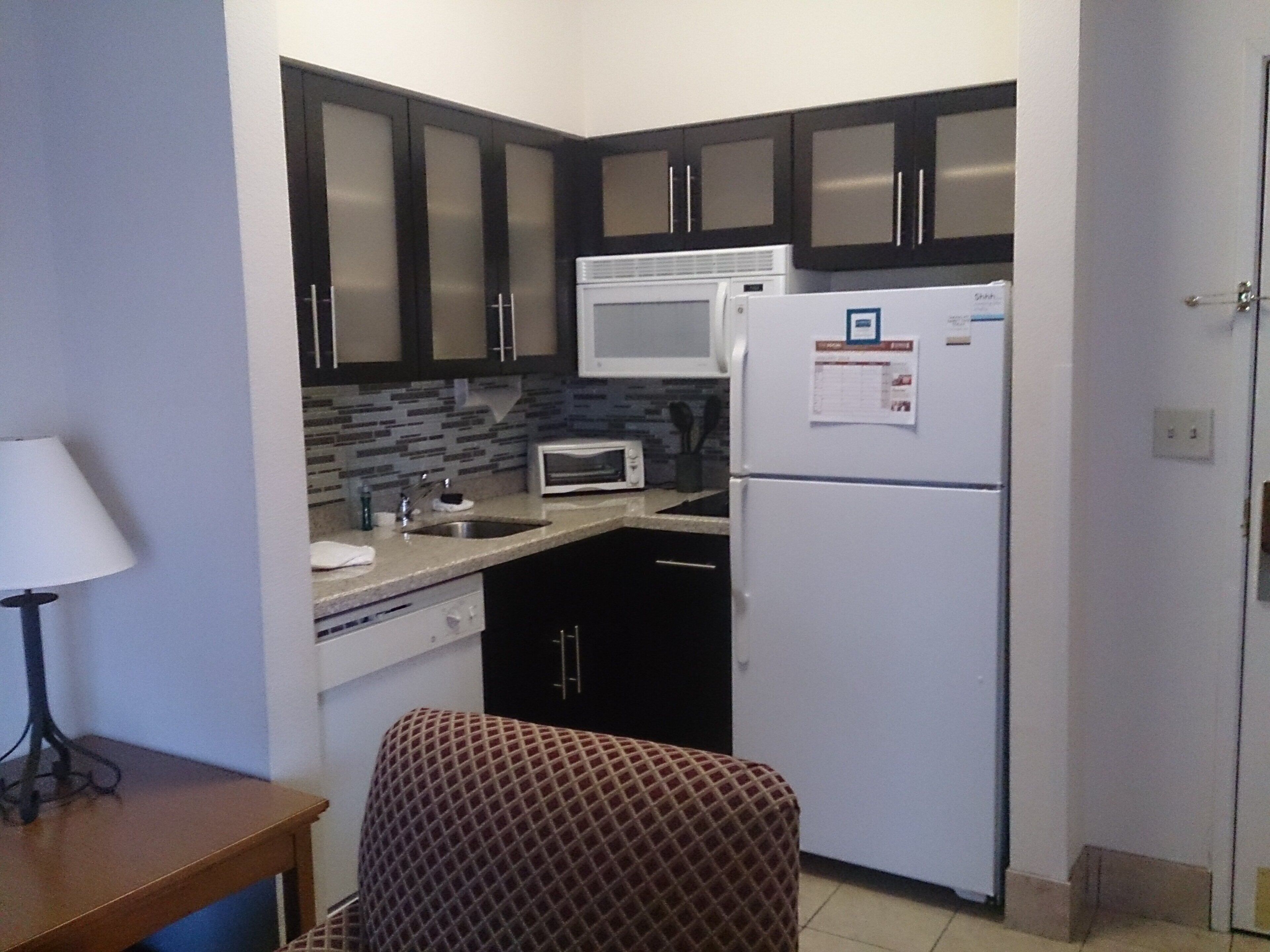 full-sized fridge, microwave, coffee/tea maker, cookware/dishes/utensils