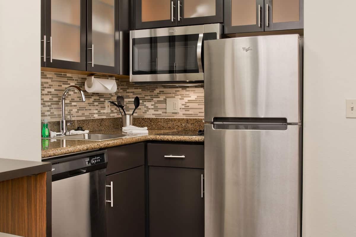 full-sized fridge, microwave, stovetop, dishwasher