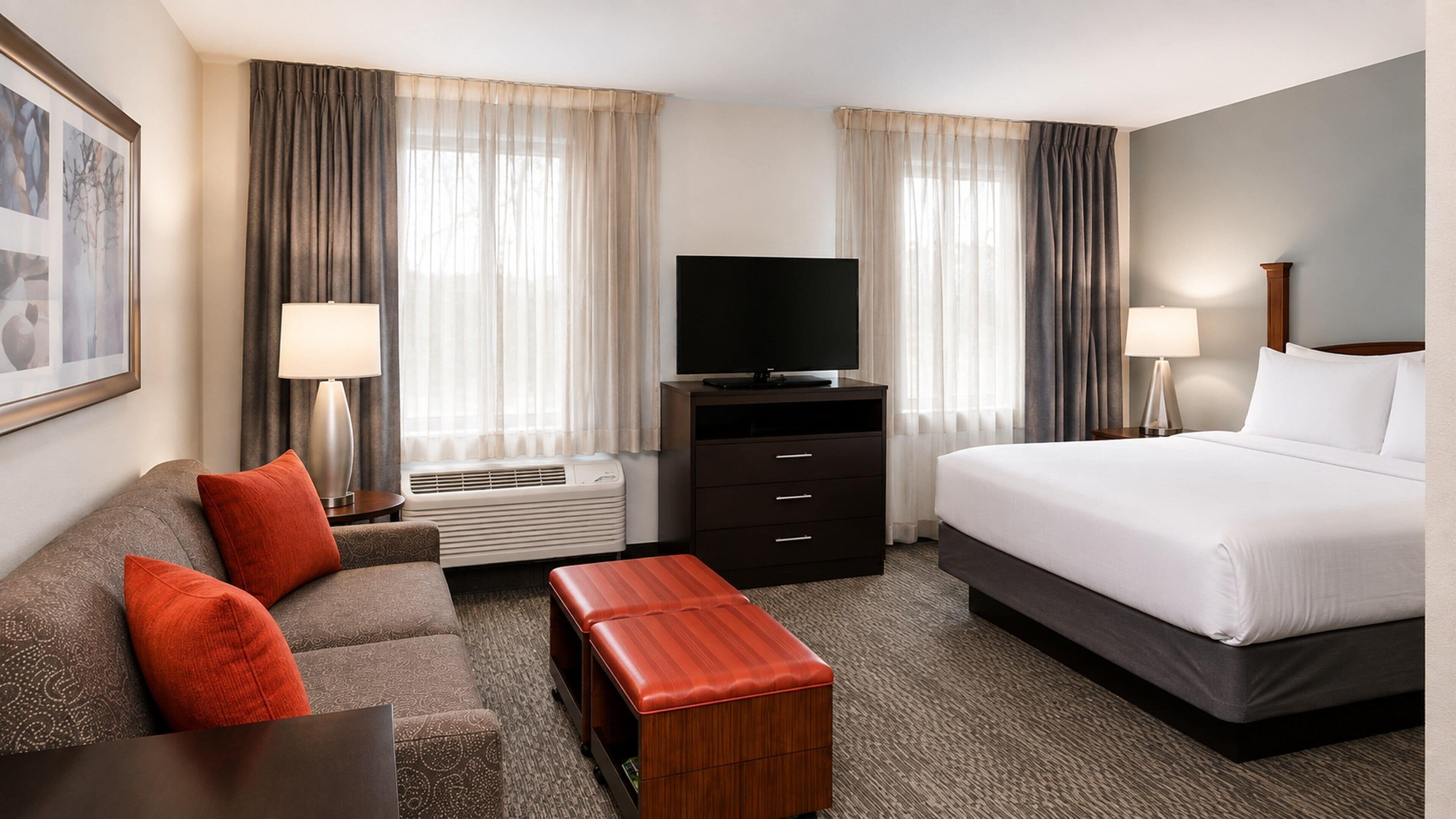 Premium bedding, desk, laptop workspace, blackout drapes