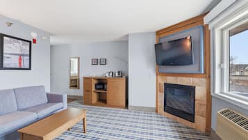 Suite Premier, 1 cama de matrimonio grande, no fumadores | Zona de estar | Una televisión de pantalla plana