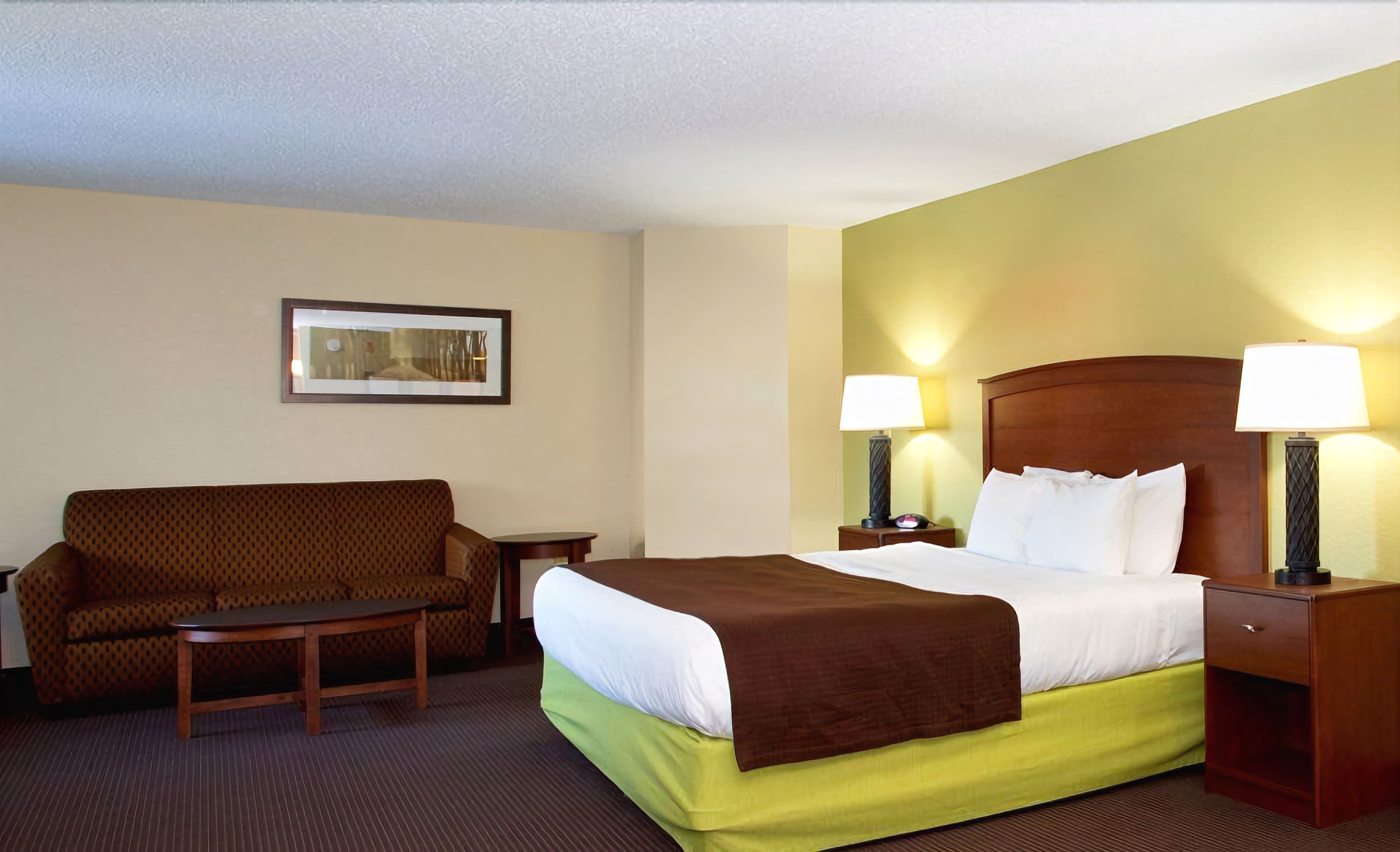 suite, 1 king bed, non smoking | in-room safe, desk, laptop workspace, soundproofing