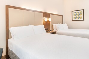 Premium bedding, pillow-top beds, desk, laptop workspace