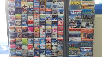 A display of travel brochures with various destinations and activities.