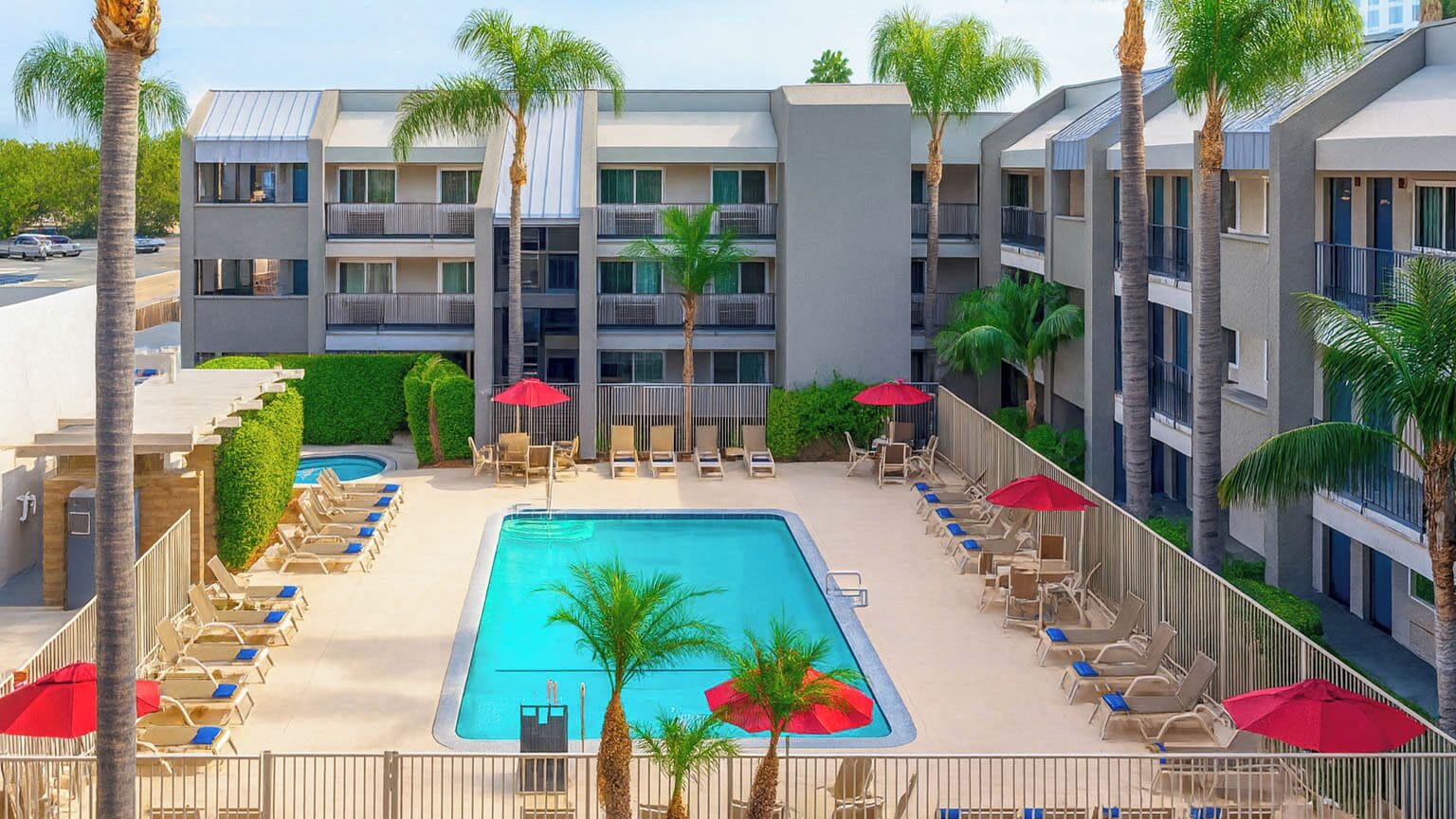 Outdoor pool, open 9:00 AM to 9:00 PM, pool umbrellas, sun loungers