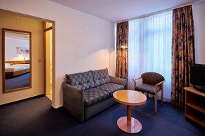 Double Room | Living area | 60-cm flat-screen TV with cable channels, TV, DVD player