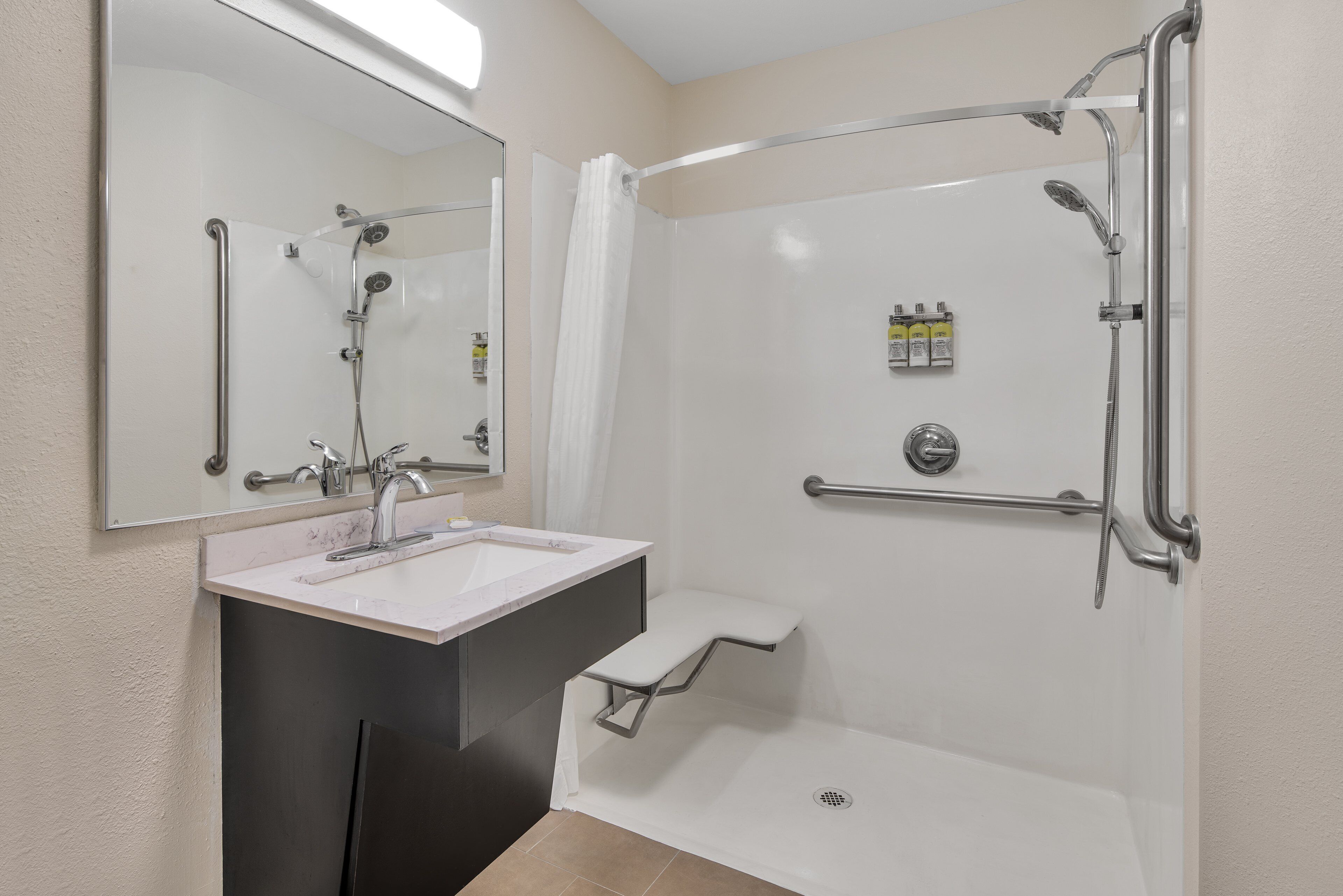 studio suite, 1 queen bed, accessible (mobility roll-in shower) | bathroom | combined shower/bathtub, hair dryer, towels