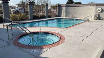 Outdoor pool, open 9:00 AM to 10:00 PM, pool umbrellas, pool loungers