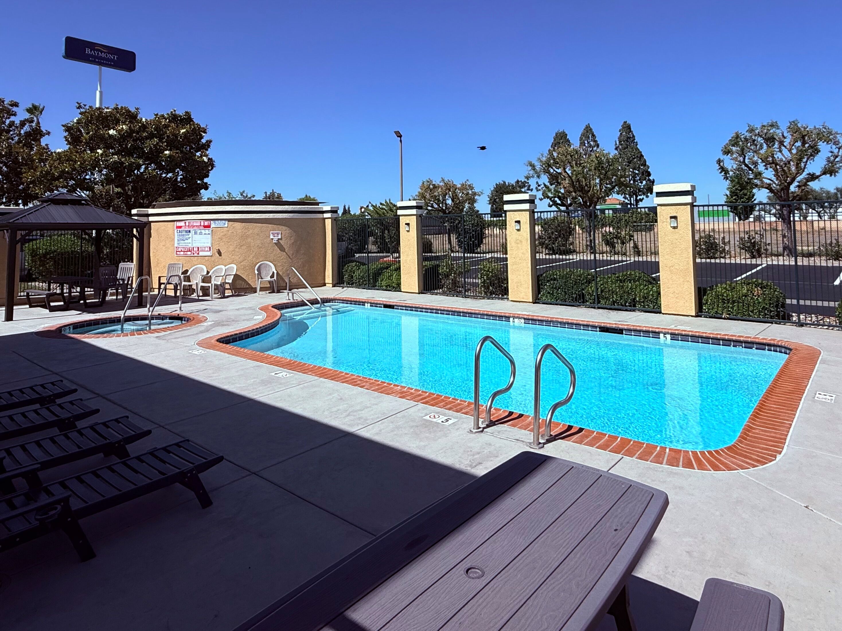 Outdoor pool, open 9:00 AM to 10:00 PM, pool umbrellas, sun loungers