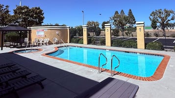 Outdoor pool, open 9:00 AM to 10:00 PM, pool umbrellas, sun loungers