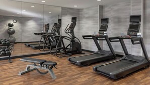A gym with treadmills, a bench, and exercise balls. - Fairfield Inn & Suites Saginaw (Saginaw)