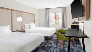 A hotel room with two beds, a desk with a chair, a flat-screen TV, and a window with curtains. - Fairfield Inn & Suites Saginaw (Saginaw)