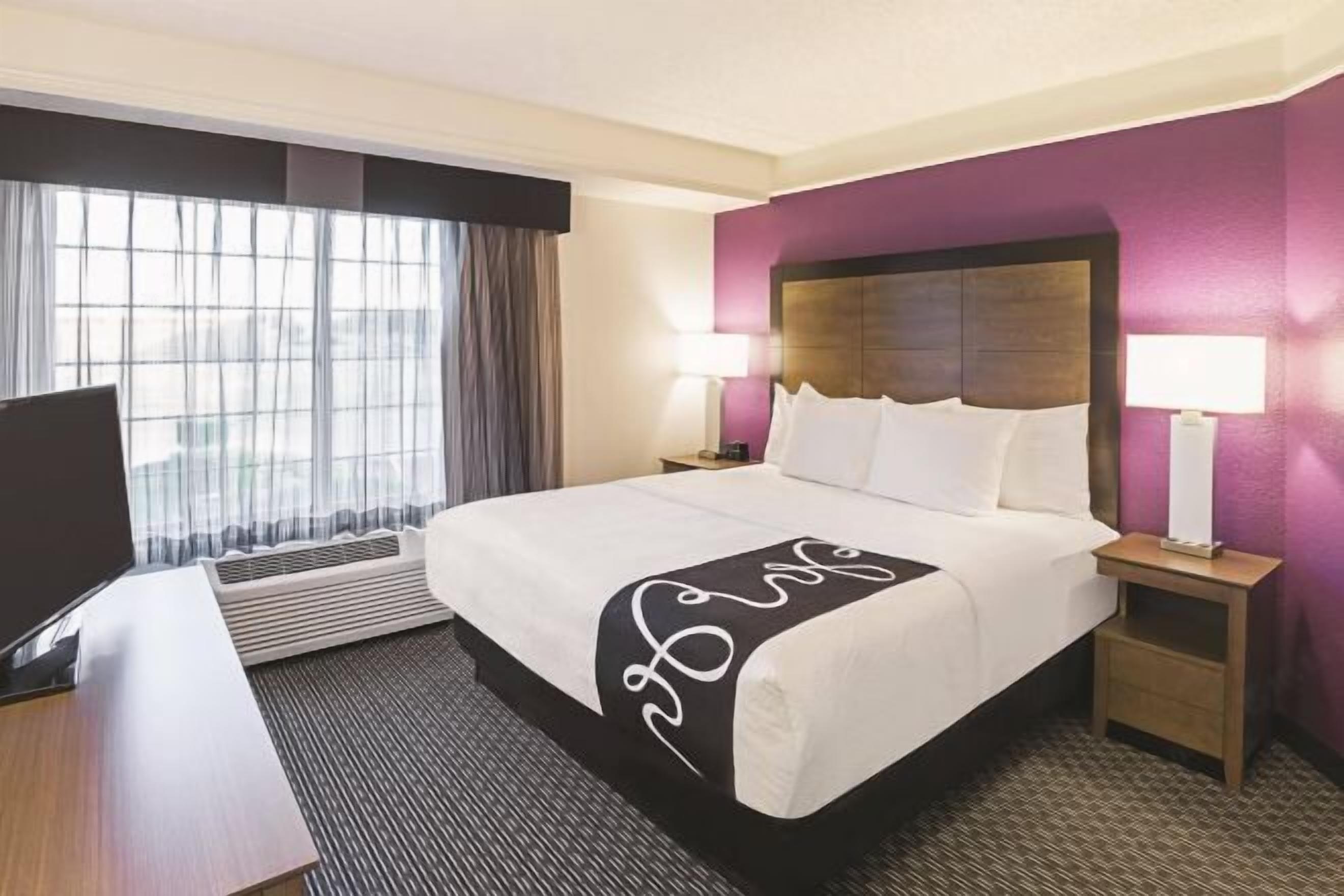 Premium bedding, desk, laptop workspace, iron/ironing board