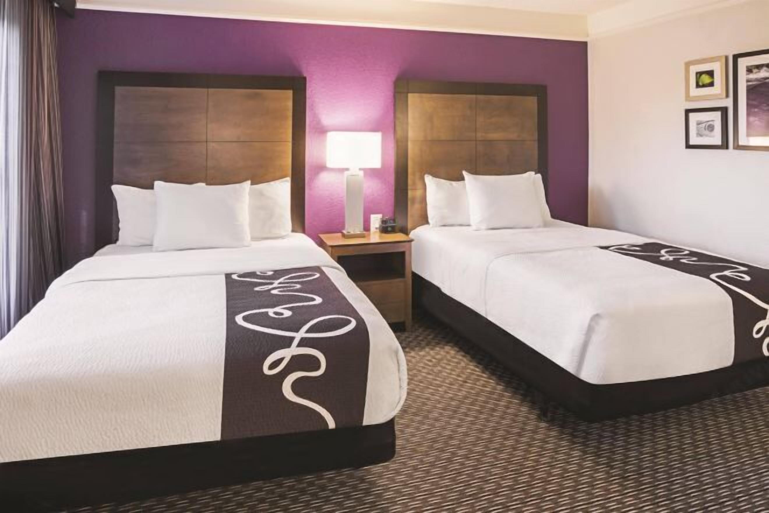 Premium bedding, desk, laptop workspace, iron/ironing board