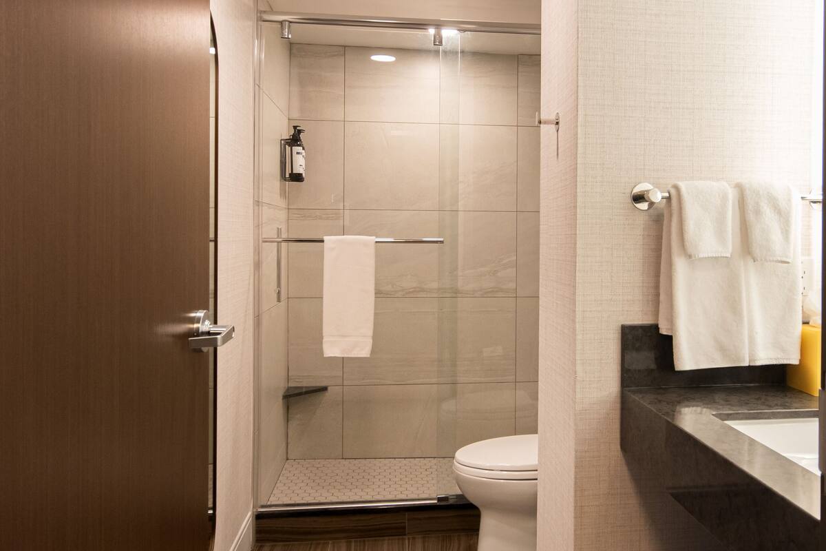 room, 1 king bed, corner | bathroom | free toiletries, hair dryer, towels, soap