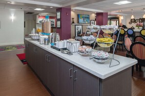 A buffet area with various food stations, including a coffee station and a salad bar. - Hampton Inn Livermore (Livermore)