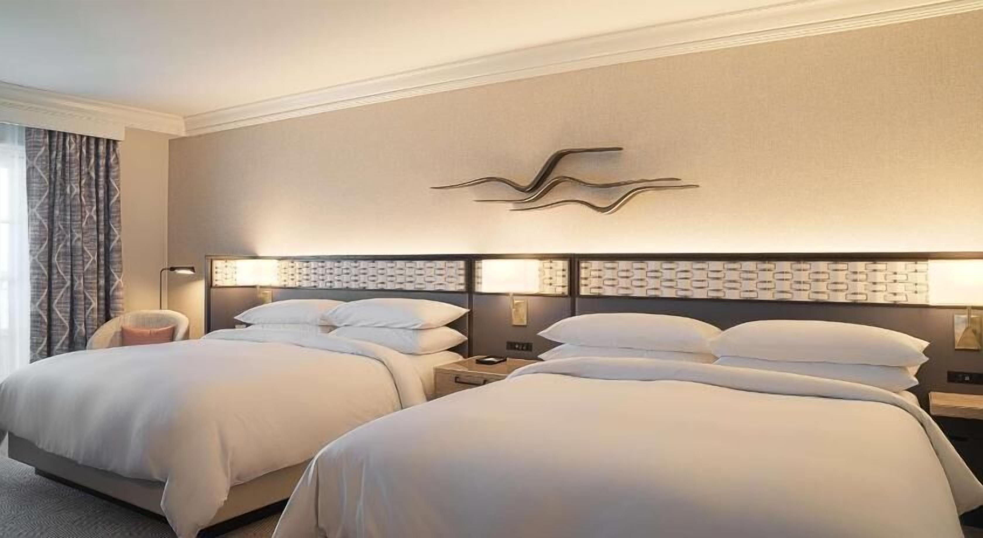 Premium bedding, down comforters, pillowtop beds, in-room safe