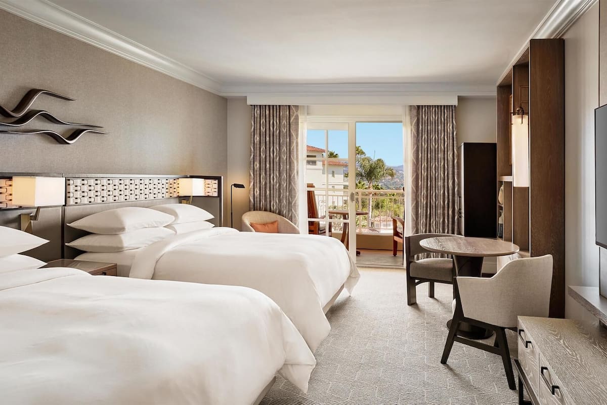 Premium bedding, down comforters, pillowtop beds, in-room safe