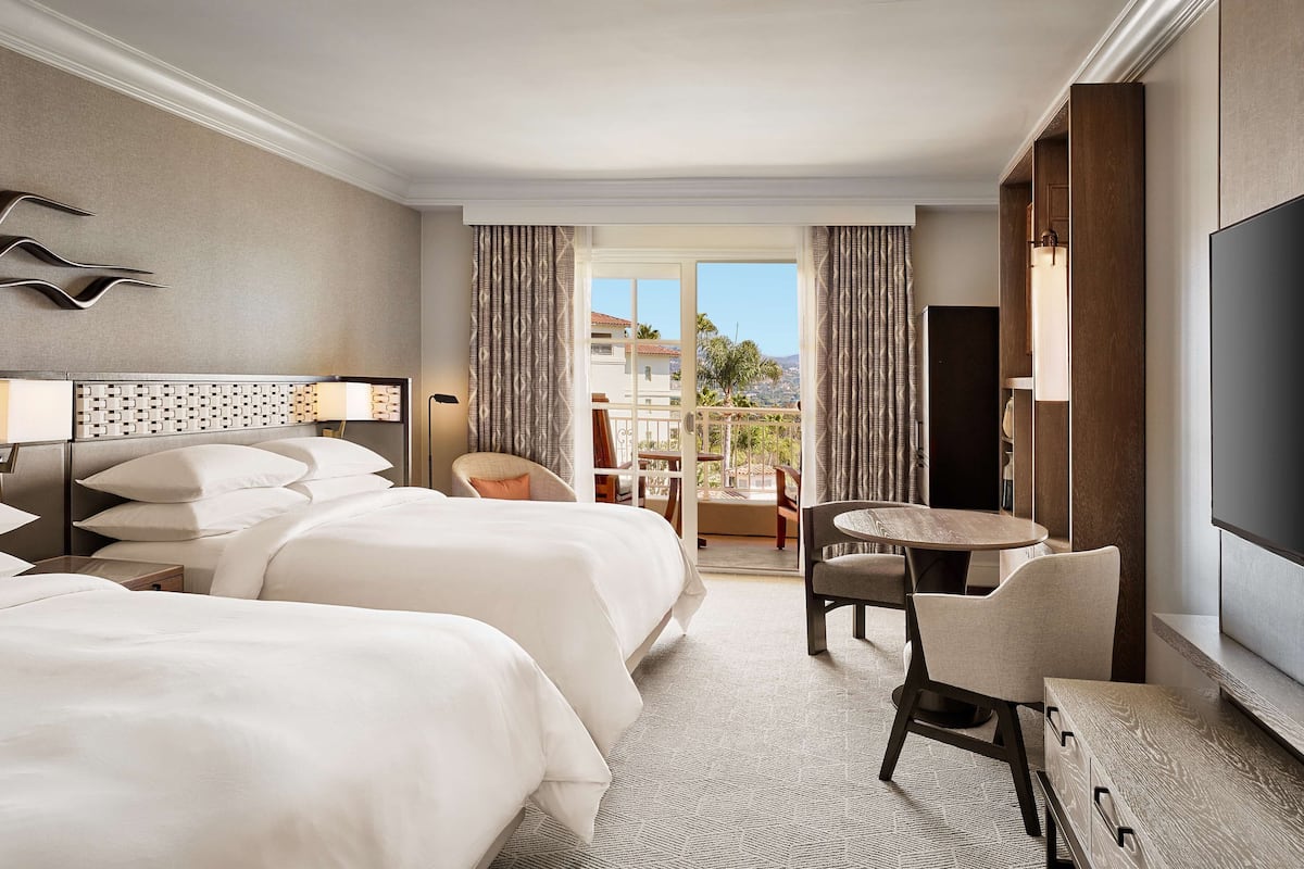 Premium bedding, down comforters, pillowtop beds, in-room safe